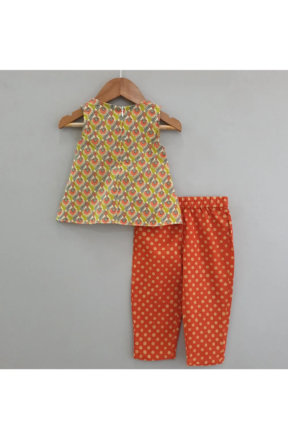 Tangy orange polka dot printed pants with tunic top